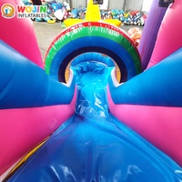 Château gonflable commercial thème Licorne, grande structure gonflable rose avec toboggan pour la location événementielle