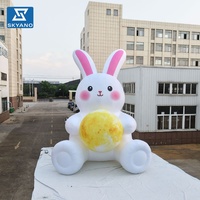 Mascotte gonflable géante personnalisée en forme de lapin de la lune pour la publicité et la décoration de parcs et lacs en extérieur