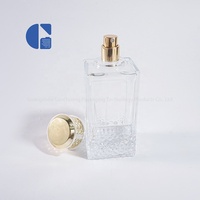 Flacon de parfum rectangulaire de luxe en verre transparent de 100 ml, flacon vide avec pulvérisateur, fond coupé et capuchon blanc doré, personnalisable