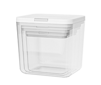 Boîte de rangement transparente pour lessive en dosettes avec couvercle à bouton-poussoir, idéale pour l'organisation de la buanderie