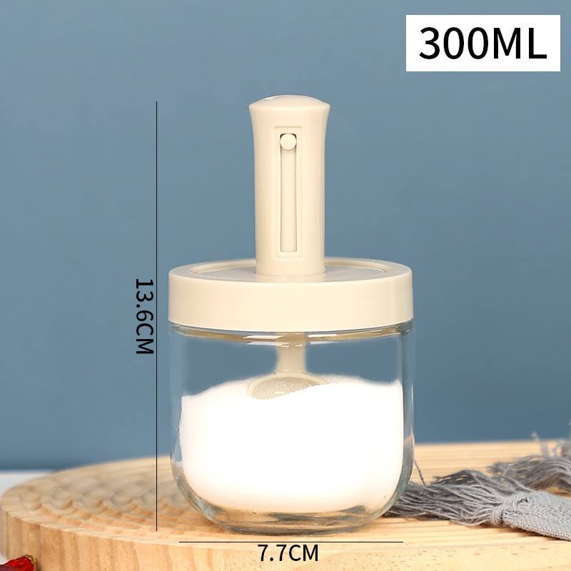 ขวดใสพร้อมฝาสีครีมและช้อน