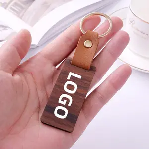 Gantungan kunci ponsel kulit PU unik, gantungan kunci kayu kenari hitam kreatif, pegangan telepon genggam