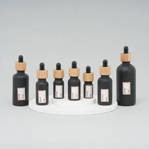 Tùy Chỉnh 5Ml 10Ml 15Ml <span class=keywords><strong>30Ml</strong></span> 50Ml 100Ml Trang Trí Matte Màu Đen Frosted Thủy Tinh Huyết Thanh Tinh Dầu Chai Nhỏ Giọt Với Nắp Tre - Product Image 1