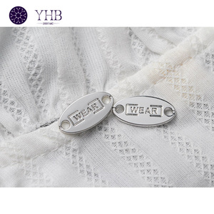 ปุ่มเย็บโลหะป้ายโลโก้อุปกรณ์เสริมสำหรับเสื้อผ้ามี2รูทรงวงรี - Product Image 2