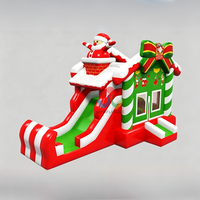 Structure gonflable de Noël avec toboggan et toit Père Noël pour enfants, idéale pour les fêtes et événements en extérieur