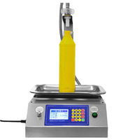 Petite machine de remplissage automatique par pesage pour miel, eau minérale, eau désinfectante, liqueur, huile comestible, colle et liquides visqueux