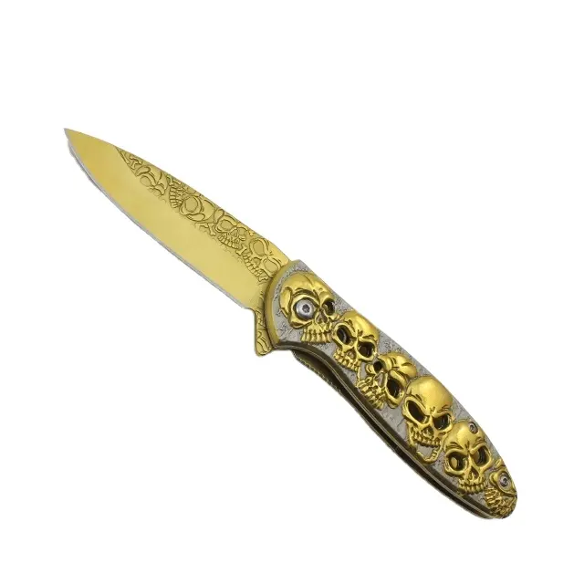 سكاكين مخصصة, سكين جيب مطلي بالتيتانيوم الذهبي مع مقبض بنمط جمجمة للنجاة في الهواء الطلق