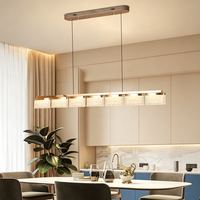Lustre suspendu contemporain nordique moderne en acrylique doré et fer, avec télécommande et hauteur réglable pour la maison, l'hôtel et le restaurant