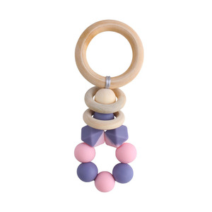 Nouveau bricolage créatif <span class=keywords><strong>anneau</strong></span> en bois <span class=keywords><strong>Gel</strong></span> <span class=keywords><strong>de</strong></span> <span class=keywords><strong>dentition</strong></span> bébé apaisant bicolore Silicone jouet pour grincer des dents - Product Image 3