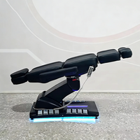 Meubles de salon de beauté modernes entièrement noirs, table de massage à 4 moteurs rotatifs, fauteuil de soin du visage électrique inclinable de luxe, lit de spa