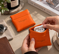 Étui mini-porte-monnaie en cuir PU orange avec fermoir à pression, petit étui pour écouteurs, logo personnalisé en relief, pour femmes, rangement de pièces de monnaie, vente en gros