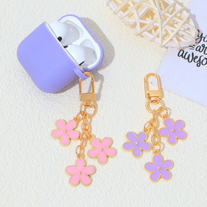 Llavero de metal con diseño de flor de doble cara y efecto de gota de aceite, colgante para bolsa de <span class=keywords><strong>Airpods</strong></span>, producto superventas transfronterizo - Product Image 1