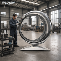 Grande sculpture circulaire en acier inoxydable poli miroir, art métallique moderne en boucles concentriques, pour cour de villa, fabrication sur mesure