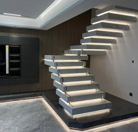 Conception de contremarche fermée moderne limon complètement caché 3 pouces bandes de roulement en pierre de quartz pile de vol flottant escalier intérieur droit
