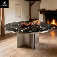 Table à manger ronde en marbre noir de luxe moderne, table à manger pour villa, base en métal incurvée unique, couleurs et dimensions personnalisables