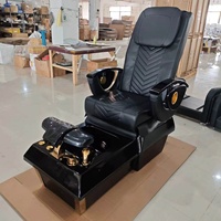 Fauteuil de pédicure de luxe noir et or avec dossier à coutures en V, finitions plaquées or, station de massage professionnelle