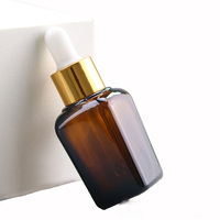Flacon carré ambré vide de 30 ml (1 oz) pour emballage cosmétique, huile essentielle, teinture pour les yeux, sérum pour le visage avec compte-gouttes doré