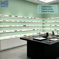 Conception d'intérieur personnalisée pour magasin d'optique, étagère d'exposition de lunettes avec mur arrière LED, mobilier de magasin d'optique, comptoir îlot pour lunettes