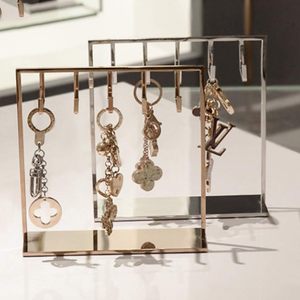 Présentoir suspendu moderne argenté et doré avec décoration de vitrine, support de rangement pour bijoux pour mobilier de magasin - Product Image 1