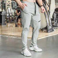 Vêtements de sport Pantalons de sport de gym pour hommes Pantalons cargo imperméables de couleur unie Pantalons maigres élégants Pantalons d'entraînement de fitness secs