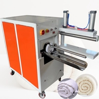 Machine à compresser et à emballer les matelas et les couettes en rouleau