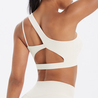 Sujetador deportivo asimétrico de un solo hombro para mujer al por mayor, con espalda recortada, transpirable, de Spandex/Nylon, soporte medio, a prueba de golpes, para correr y gimnasio.