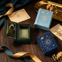 Nouvelle boîte à bijoux vintage en forme de mini livre, en cuir PU éponge, imprimée quatre couleurs, estampée à chaud, pour rangement de bagues, pendentifs et montres motif ciel étoilé