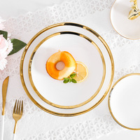 Vente en gros sur mesure, ensemble d'assiettes plates en céramique blanche de luxe pour mariage avec bordure dorée, assiettes à vaisselle pour restaurant