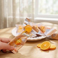 Sucettes sphériques en gros OEM ODM au jus de fruits lactiques, graines de chia et pomelo, bonbons durs emballés individuellement