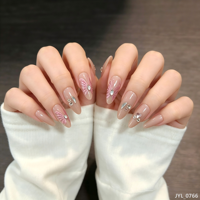 24 faux ongles en ABS à presser, couleur rose nude, motif papillon et strass, forme amande moyenne, réutilisables, design rêveur et doux