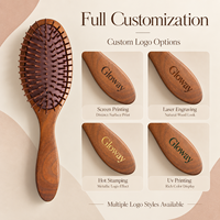Brosse à cheveux ovale en bois brun de haute qualité OEM, brosse démêlante et massante en bois naturel pour les soins capillaires quotidiens