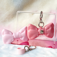 Gloss à lèvres en forme de nœud, corps opaque brillant, flacons à nœud ruban, tons corail et rose, applicateur doe foot floqué, approvisionnement en gros, logo personnalisé, OEM