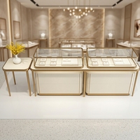Comptoir de présentation de bijoux de luxe personnalisé avec cadre doré, vitrine en verre LED pour boutique de diamants et de pierres précieuses