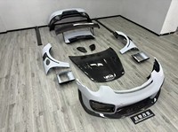 Kit carrosserie pour nouvelle Porsche 911/991 Turbo : pare-chocs avant, jupes latérales, garde-boue, diffuseur arrière et capot, style semi-carbone