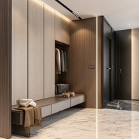 Meuble de rangement sur mesure pour manteaux et chaussures avec banquette longue, niche suspendue et portes pleine hauteur pour entrées résidentielles modernes