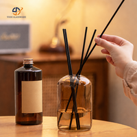 Ensemble diffuseur à roseaux en verre rond en gros avec huile parfumée et roseaux noirs pour la fragrance et la décoration intérieure