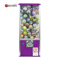 Distributeur de jouets à monnayeur : bonbons, balles rebondissantes, capsules et autres jouets