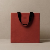 Maßgefertigte Luxus Orange Papiertüte mit Bandgriff Bedrucktes Logo Geschenkpapiertüte
