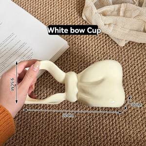 Vente en gros de tasses à café en céramique avec anse longue, design nœud - Product Image 6