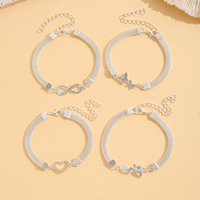 Bracelets superposés tendance en alliage d'argent, lot de 4, avec breloques infini, papillon, cœur et cristal, chaîne multi-brins et maillons, cadeau de fête