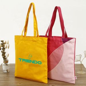 กระเป๋าผ้าแคนวาสสีเหลืองสไตล์นักช้อปของชำ สำหรับใส่ของช้อปปิ้ง พิมพ์โลโก้เองได้ พร้อมช่องใส่ของและซิป - Product Image 1