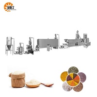 Machine d'extrusion de riz instantané nutritif, système de fabrication de riz instantané, usine de production de riz fortifié