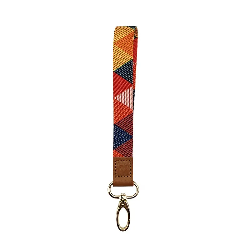 Wholesale high quality sublimation leather mobile phone wrist hand lanyard straps key chain with nylon pad patch for phone case