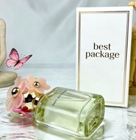 Flacon de parfum en verre transparent violet personnalisé de haute qualité avec bouchon en forme de fleur blanche