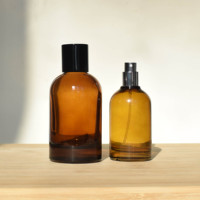 Botella de Perfume Redonda de Vidrio Vacía de Lujo al por Mayor de 30ml 50ml 100ml con Pulverizador y Tapa Negra Ámbar con Logotipo Personalizado por Estampado en Caliente