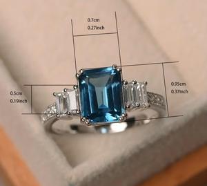 แหวนเงินแท้ 925 ประดับบลูโทแพซธรรมชาติทรงแปดเหลี่ยมขนาด 7x5 มม. พร้อมโมอิสซาไนต์ทรงบาแกตต์และทรงกลม แหวนทำมือ - Product Image 6