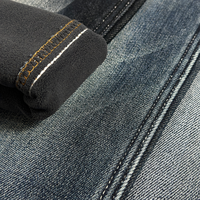 Tissu denim bleu gris 12 oz, 18 % de rétrécissement élevé, mercerisé, effet slub, certifié OEKO-TEX 100, prix usine du denim brut