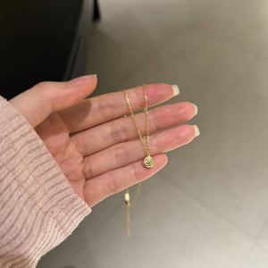 สร้อยคอจี้รูปอมยิ้มเล็กๆ ดีไซน์สวยหรูจาก Dylam Charm Fine Jewelry ชุบทอง 14K ผิวขัดเงา เงินแท้ S925 สำหรับเด็กผู้หญิง ผู้หญิง และสุภาพสตรี - Product Image 6