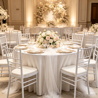 Chaise Chiavari empilable blanche à prix d'usine, structure métallique, chaise de banquet de mariage avec coussin
