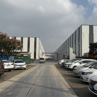 Garage en acier préfabriqué multi-niveaux de grande capacité, design moderne, garage métallique stéréo pour un stationnement simple, abri de voiture